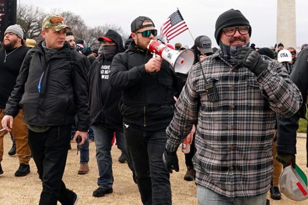 Proud Boys members including Zachary Rehl, left, Ethan Nordean, center, and Joseph Biggs, walk toward the U.S. Capitol in Washington, in support of President Do<em></em>nald Trump on Jan. 6, 2021.