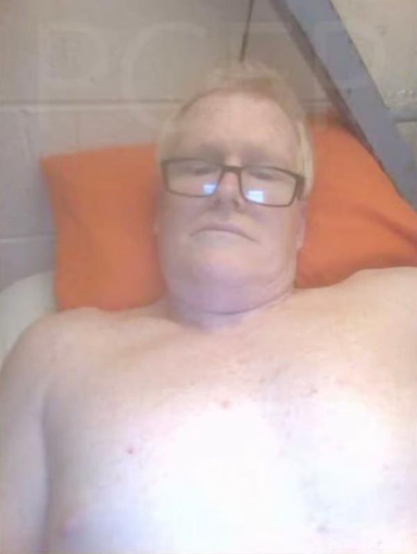 Alex Murdaugh is seen lounging in his prison cell taken on his tablet. 