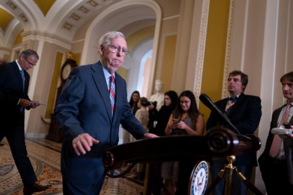 Senate Minority Leader Mitch McConnell, R-Ky., walks to speak with reporters at the Capitol in Washington, Wednesday, July 26, 2023. 