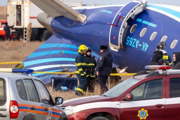 Emergency specialists work at the crash site of an Azerbaijan Airlines passenger jet near the western Kazakh city of Aktau on Wednesday.